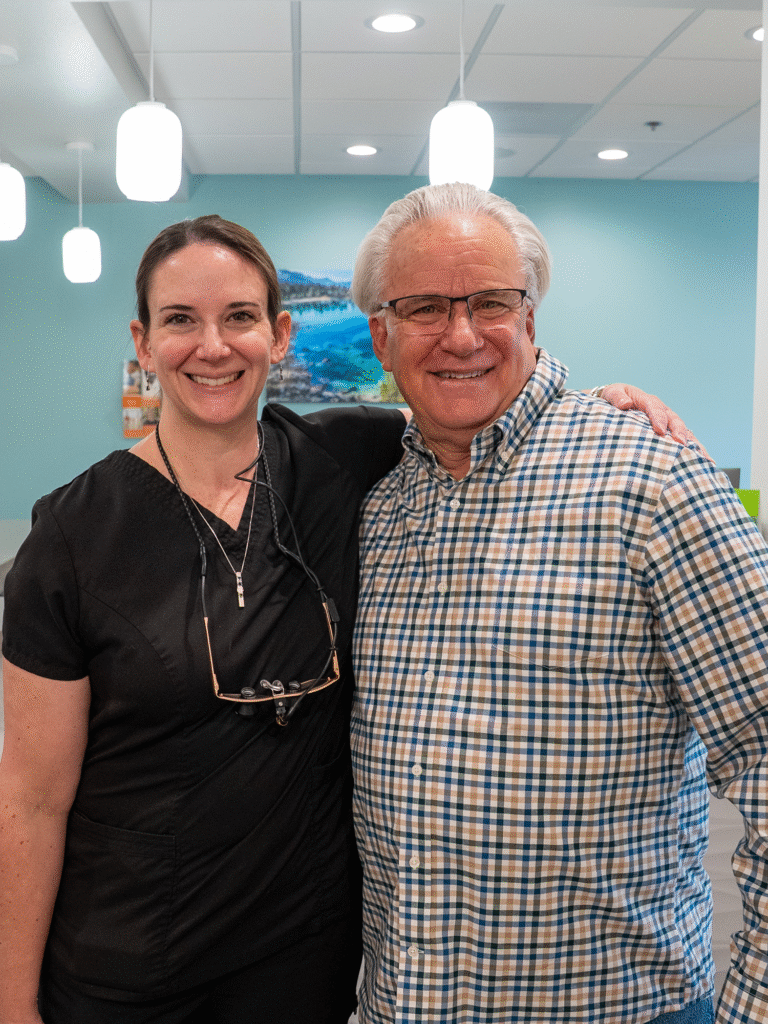 Dr. French and patient Brian smiling in the lobby of the practice
