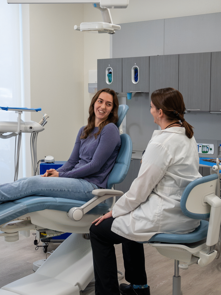 Dr. French and patient smiling in dental chair