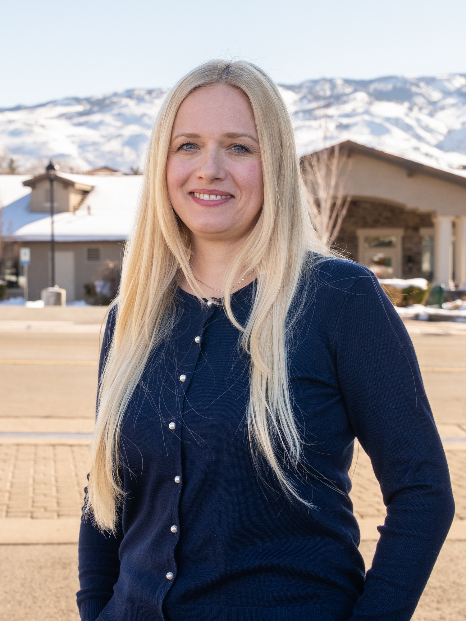 Dr. Amy French's patient Anne smiling outside of the practice